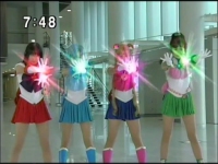 The Sailor Senshi combine powers to break down the force field